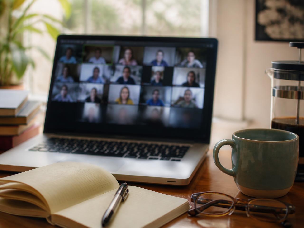 Laptop on a warm desk during an online Zoom teaching session